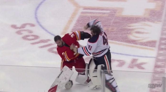 Mike-Smith-vs.-Cam-Talbot-goalie-fight Mike Smith fights Cam Talbot at center ice during the Battle of Alberta between the Edmonton Oilers and Calgary Flames
