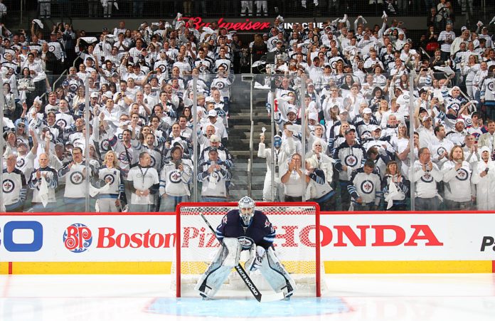 Connor Hellebyuck Winnipeg Jets' goalie Connor Hellebuyck in front of the Winnipeg whiteout