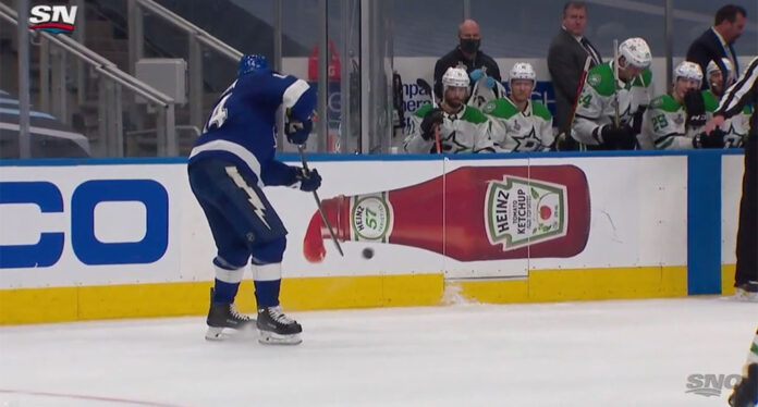 Patrick-Maroon Tampa Bay Lightning forward Patrick Maroon shoots the puck into the Dallas Stars bench