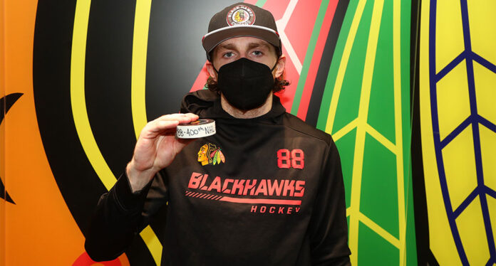 Patrick-Kane-400th-NHL-goal Chicago Blackhawks forward Patrick poses with his 400th NHL goal puck