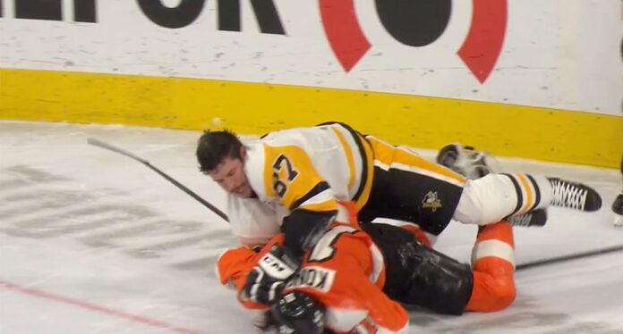 Crosby-and-Konecny Pittsburgh Penguins captain Sidney Crosby wrestles with Philadelphia Flyers forward Travis Konecny