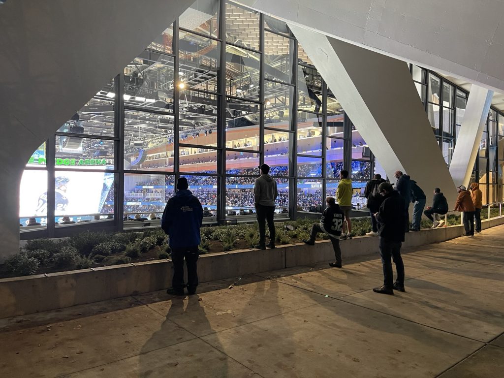 Seattle Kraken fans watch outside Climate Pledge Arena