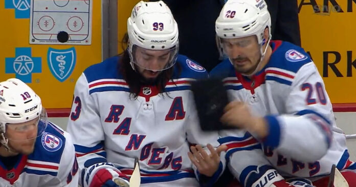 Kreider-tablet Chris Kreider throws tablet away from Mika Zibanejad