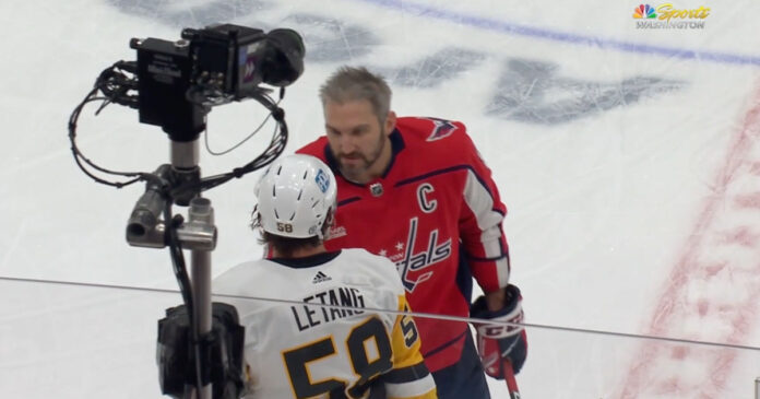Ovechkin-Letang Alex Ovechkin checks in with Kris Letang