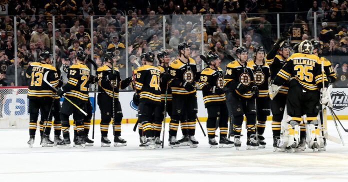 Bruins-clinch Bruins celebrate winning Presidents Trophy