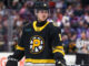 NHL Neck Guard Rule: Every Rookie Must Wear One in 2026-27 Providence Bruins left wing Georgii Merkulov wearing neck guard