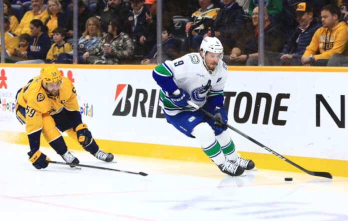 Rangers, Canucks Pull Off Blockbuster JT Miller trade Nashville Predators defenseman Roman Josi (59) defends against Vancouver Canucks center J.T. Miller (9) during the NHL game between the Nashville Predators and Vancouver Canucks, held on January 29, 2025, at Bridgestone Arena in Nashville, Tennessee