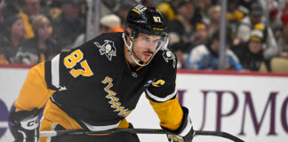 Penguins’ Crosby Being Evaluated for Injury After Devils Game Sidney Crosby prepares to take faceoff