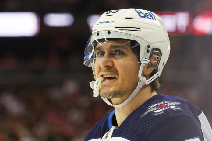 NHL: MAR 21 Jets at Devils NEWARK, NJ - MARCH 21: Winnipeg Jets center Mark Scheifele (55) looks on during a game between the Winnipeg Jets and New Jersey Devils on March 21, 2024 at Prudential Center in the Newark, New Jersey.
