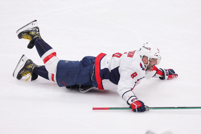 NHL: APR 06 Capitals at Islanders ELMONT, NY - APRIL 06: Washington Capitals left wing Alex Ovechkin (8) celebrates after scoring his 895th career goal breaking the NHL record for most goals ever in a NHL game between the Washington Capitals and New York Islanders at UBS Arena on April 6, 2025 in Elmont, New York.