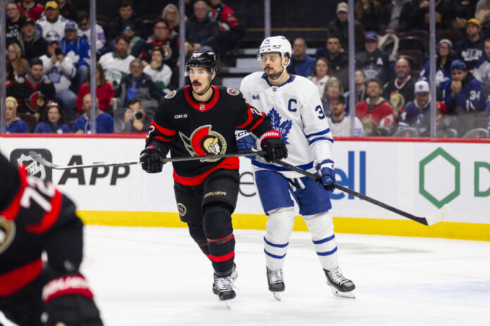 dgb250125018_tor_at_ott(1) Ottawa Senators Defenceman Travis Hamonic (23) and Toronto Maple Leafs center Auston Matthews (34) during second period National Hockey League action between the Toronto Maple Leafs and Ottawa Senators on January 25, 2025, at Canadian Tire Centre in Ottawa, ON, Canada