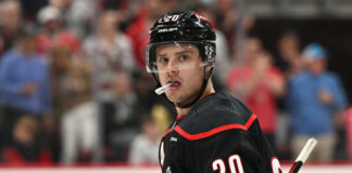 Sebastian Aho Sends Hurricanes To Second Round With Double-Overtime Winner RALEIGH, NC - MARCH 28: Carolina Hurricanes center Sebastian Aho (20) looks down the bench after scoring a goal during the NHL game between the Montreal Canadiens and the Carolina Hurricanes on March 28, 2025 at Lenovo Center in Raleigh, North Carolina.