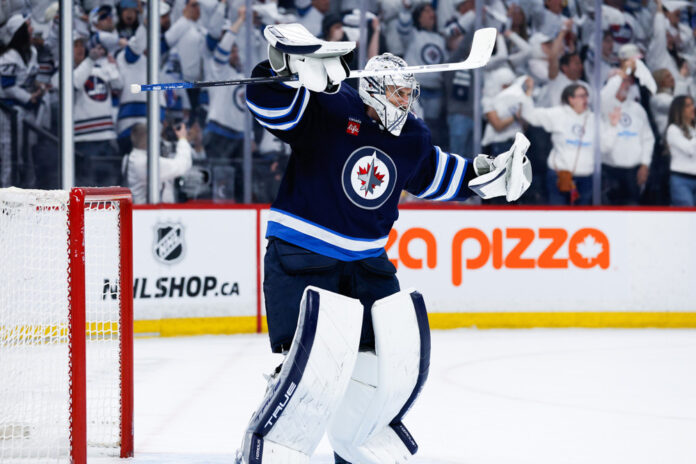 NHL: APR 21 Stanley Cup Playoffs First Round Blues at Jets WINNIPEG, MB - APRIL 21: Winnipeg Jets goalie Connor Hellebuyck (37) celebrates his win against the St. Louis Blues at the end of the third period of game 2 of the first round of the Stanley Cup Playoffs between the Winnipeg Jets and the St. Louis Blues on April 21,2025 at the Canada Life Centre Winnipeg, Manitoba.