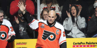 Flyers Hire Rick Tocchet As New Head Coach PHILADELPHIA, PA - NOVEMBER 15: Philadelphia Flyers Alumni coach Rick Tocchet (22) waves during the Flyers Alumni Orange and Black game on November 15, 2021 at Wells Fargo Center in Philadelphia, PA.