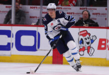 Jets Lose Seventh Straight as Skinner Is Pulled and Daws Debuts Winnipeg Jets center Mark Scheifele skates with the puck