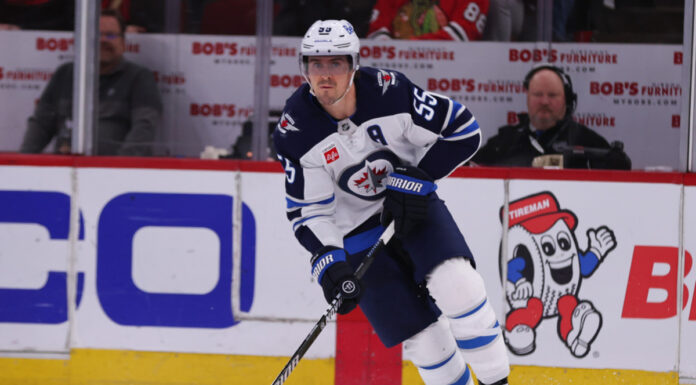 Jets Lose Seventh Straight as Skinner Is Pulled and Daws Debuts Winnipeg Jets center Mark Scheifele skates with the puck