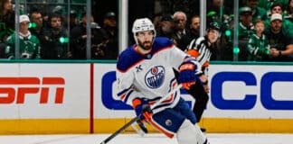 Evan Bouchard Suffers Scary Injury After Ryan Lindgren Hit at World Championship Edmonton Oilers defenseman Evan Bouchard skates with the puck