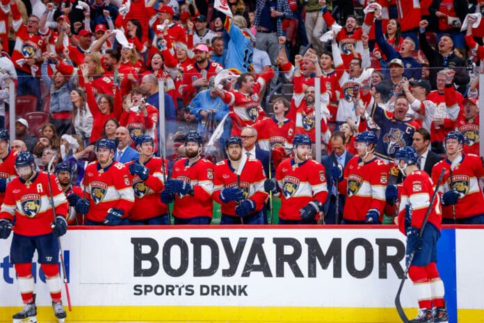 SUNRISE, FL - MAY 09: From (L-R) Florida Panthers Defenseman Aaron Ekblad (5), Defenseman Nate Schmidt (88), Center Sam Bennett (9), Left Wing Jonah Gadjovich (12), Left Wing A.J Greer (10), Center Sam Bennett (9), Center Carter Verhaeghe (23), Center Sam Reinhart (13) and Center Anton Lundell (15) look on during a timeout during the Stanley Cup Playoffs 2nd Round game between the Toronto Maple Leafs and the Florida Panthers on Friday May 9, 2025 at Amerant Bank Arena in Sunrise, Fla. Florida Panthers celebrate on the bench