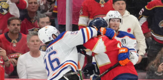 Jake Walman Receives Two $5,000 Fines For Actions in Stanley Cup Final Game 3 SUNRISE, FL - JUNE 09: while being held by an Edmonton players, Edmonton Oilers defenseman Jake Walman (96) punches Florida Panthers left wing Matthew Tkachuk (19) in the face in the third period during game three of the Stanley Cup Finals between the Edmonton Oilers and the Florida Panthers on June 9, 2025 at Amerant Bank Arena, FL.