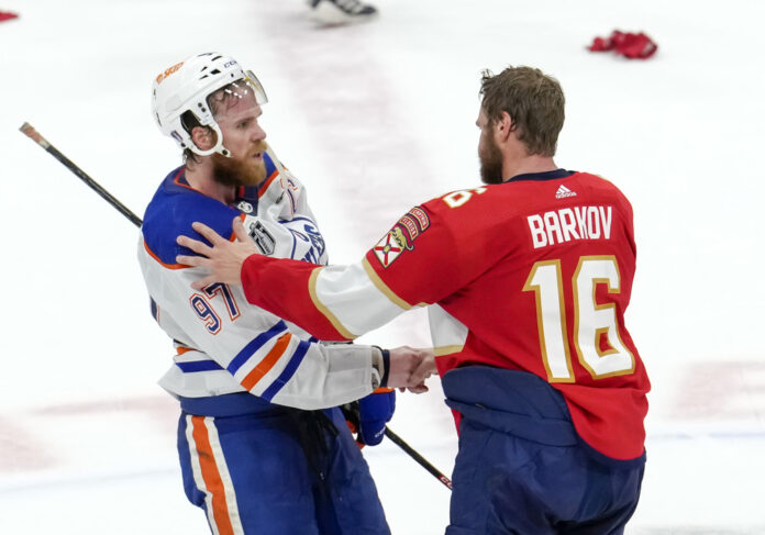 NHL: JUN 24 Stanley Cup Final - Oilers at Panthers SUNRISE, FL - JUNE 24: Edmonton Oilers center Connor McDavid (97) and Florida Panthers center Aleksander Barkov (16) meet for a hand shake at center ice during the NHL Stanley Cup Finals, Game 7 between the Florida Panthers and Edmonton Oilers on June 24th, 2024 at Amerant Bank Arena in Sunrise, FL.