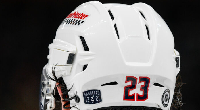 Gaudreau Brothers Anniversary: Two Years Since Aug. 29, 2024 Gaudreau 13 21 helmet decal honoring Johnny Gaudreau and Matthew Gaudreau on Sean Monahan's Blue Jackets helmet