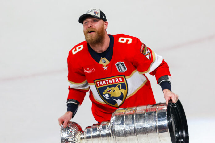 NHL: JUN 17 Stanley Cup Final Oilers at Panthers Florida Panthers center Sam Bennett celebrates with the Stanley Cup at Amerant Bank Arena