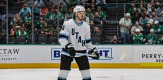 DALLAS, TX - APRIL 12: Utah Hockey Club defenseman Mikhail Sergachev (98) looks for the puck during the game between the Dallas Stars and the Utah Hockey Club on April 12, 2025 at American Airlines Center in Dallas, Texas.