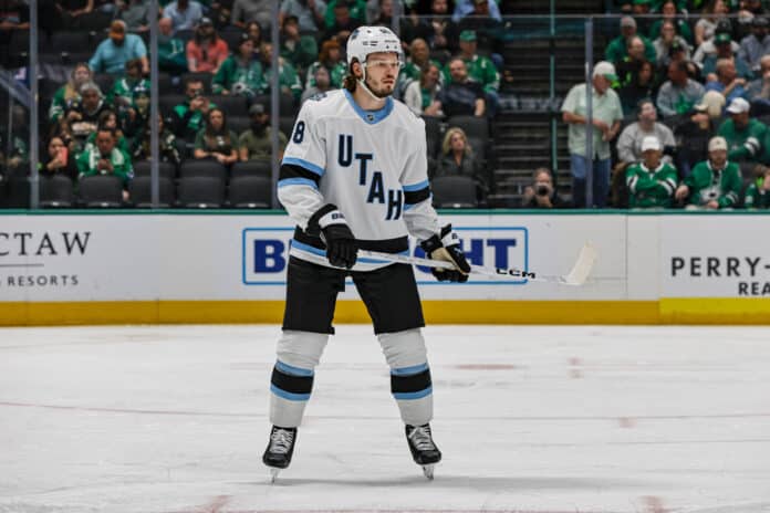 DALLAS, TX - APRIL 12: Utah Hockey Club defenseman Mikhail Sergachev (98) looks for the puck during the game between the Dallas Stars and the Utah Hockey Club on April 12, 2025 at American Airlines Center in Dallas, Texas. DALLAS, TX - APRIL 12: Utah Hockey Club defenseman Mikhail Sergachev (98) looks for the puck during the game between the Dallas Stars and the Utah Hockey Club on April 12, 2025 at American Airlines Center in Dallas, Texas.