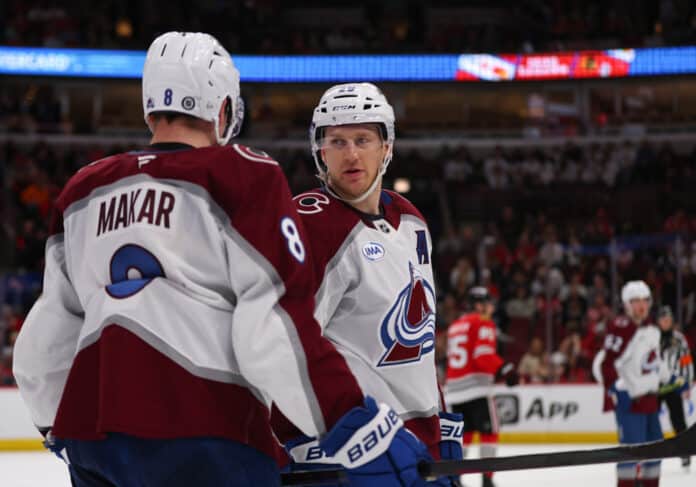 CHICAGO, IL - APRIL 02: Nathan MacKinnon #29 of the Colorado Avalanche chats with Cale Makar #8 of the Colorado Avalanche during the second period against the Chicago Blackhawks on April 2, 2025 at the United Center in Chicago, Illinois. CHICAGO, IL - APRIL 02: Nathan MacKinnon #29 of the Colorado Avalanche chats with Cale Makar #8 of the Colorado Avalanche during the second period against the Chicago Blackhawks on April 2, 2025 at the United Center in Chicago, Illinois.