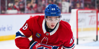 Lane Hutson Signs Massive Extension with Montreal Canadiens Montreal Canadiens defenseman Lane Hutson looks on