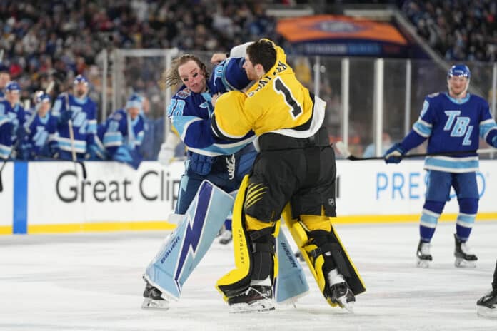 NHL: FEB 01 Stadium Series Bruins vs Lightning Tampa Bay Lightning goaltender Andrei Vasilevskiy lands a punch on Boston Bruins Jeremy Swayman