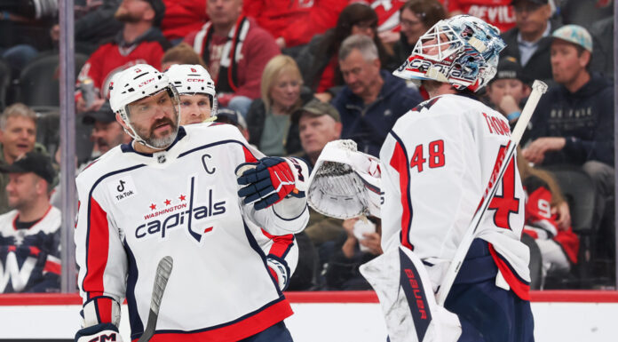 Ovechkin Injury Update: Out for Rest of Preseason Alex Ovechkin high-fives goaltender Logan Thompson during a Capitals game at Prudential Center