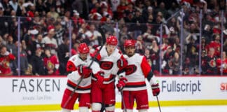 Alexander Nikishin Carolina Hurricanes helped off the ice by Shayne Gostisbehere and Seth Jarvis Game 4 2026 Stanley Cup Playoffs Senators concussion