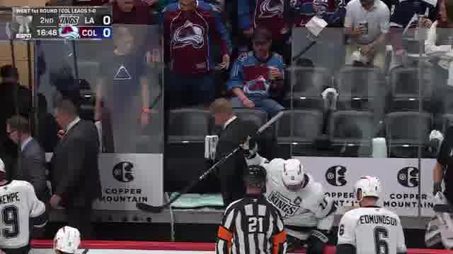 avs_glass_shatter_kings_bench The shattered glass panel behind the Los Angeles Kings bench at Ball Arena