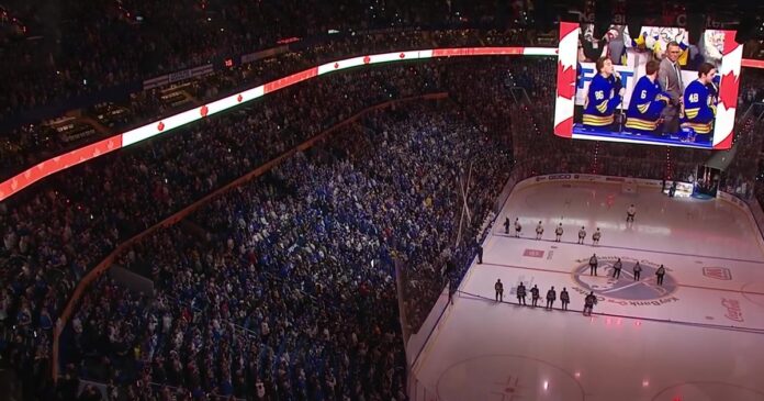 buffalo_sabres_fans_o_canada_anthem KeyBank Center crowd sings O Canada with Canadian flag display lit up before Game 5 of Sabres vs Bruins