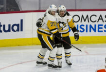 Crosby, Malkin, Letang Set NHL Record for Wins by a Trio Sidney Crosby and Evgeni Malkin celebrate a goal together on the ice