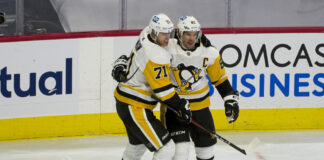 Crosby, Malkin, Letang Set NHL Record for Wins by a Trio Sidney Crosby and Evgeni Malkin celebrate a goal together on the ice