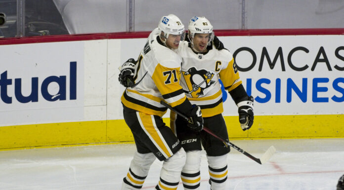 Crosby, Malkin, Letang Set NHL Record for Wins by a Trio Sidney Crosby and Evgeni Malkin celebrate a goal together on the ice