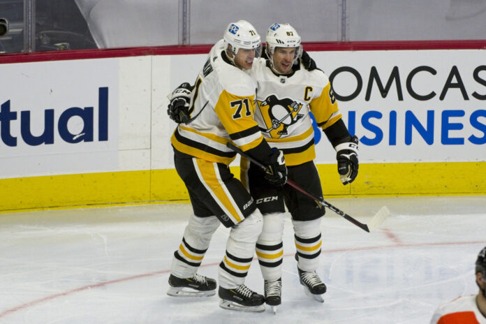 NHL: JAN 13 Penguins at Flyers Sidney Crosby and Evgeni Malkin celebrate a goal together on the ice