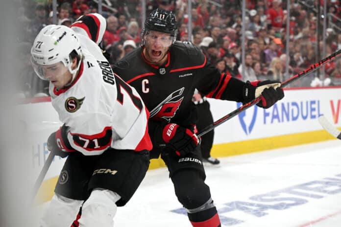 Jordan Staal Checks Ridly Greig 2026 Stanley Cup Playoffs Jordan Staal of the Carolina Hurricanes checks Ridly Greig of the Ottawa Senators during Game 1 of the 2026 Stanley Cup Playoffs First Round at Lenovo Center