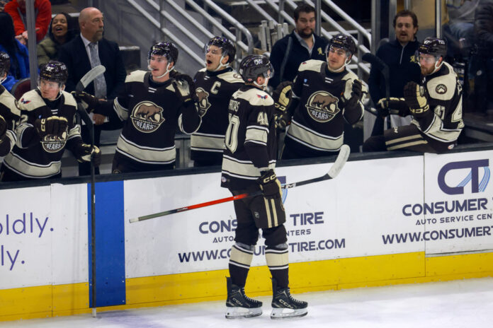 AHL: NOV 20 Hershey Bears at Cleveland Monsters Hershey Bears center Ilya Protas is congratulated by teammates after scoring a goal against the Cleveland Monsters
