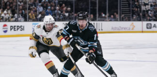 Bruins Acquire JJ Peterka in Trade With Mammoth JJ Peterka Utah Mammoth controls the puck against Colton Sissons Vegas Golden Knights Game 4 NHL Stanley Cup Playoffs First Round Delta Center