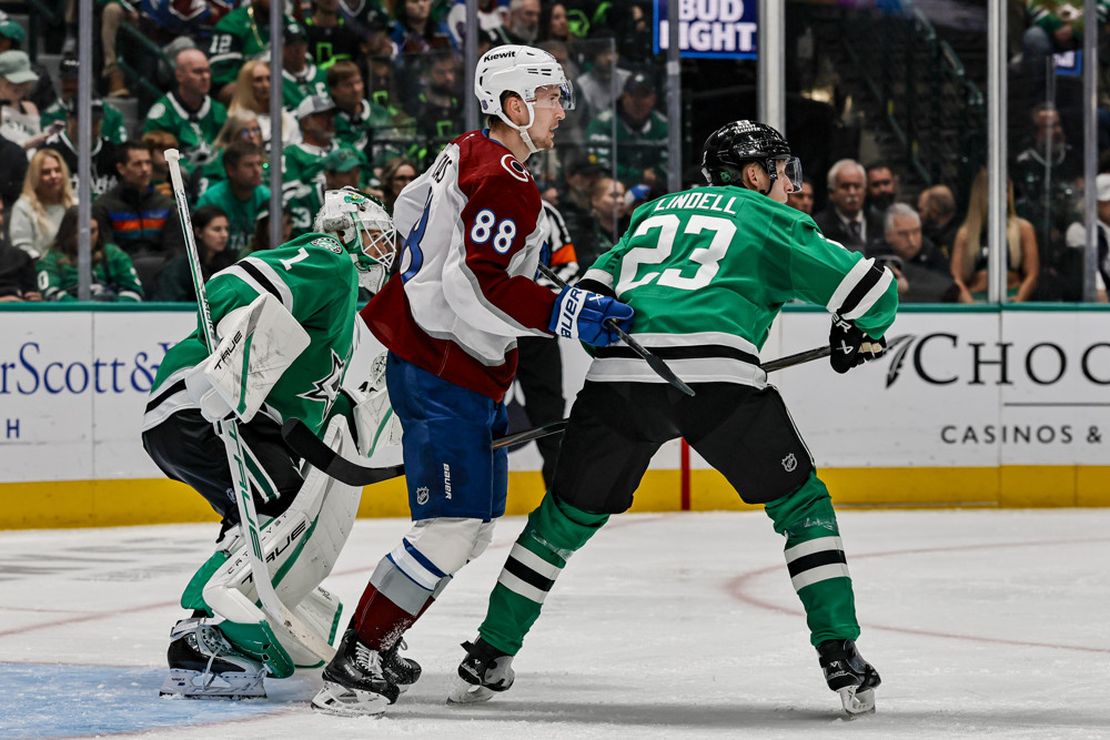 Martin Necas of the Colorado Avalanche works the net front against the Dallas Stars