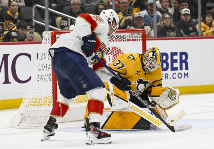 NHL: APR 05 Panthers at Penguins Matthew Tkachuk of the Florida Panthers presses the net against the Pittsburgh Penguins