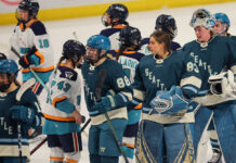 Hockey Night in Canada Returning With PWHL, Report Says New York Sirens and Seattle Torrent players shake hands after a PWHL Takeover Tour game
