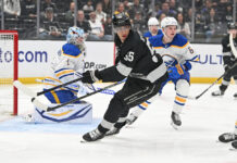 Quinton Byfield of the LA Kings turns toward the play during a game at Crypto.com Arena