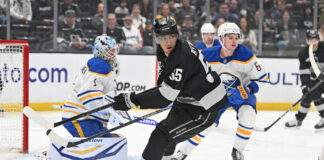 Quinton Byfield No. 1 Center: Kings Move On From Kopitar Quinton Byfield of the LA Kings turns toward the play during a game at Crypto.com Arena