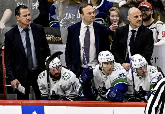 NHL: FEB 11 Canucks at Capitals Vancouver Canucks coaching staff Adam Foote Mike Yeo Rick Tocchet on the bench