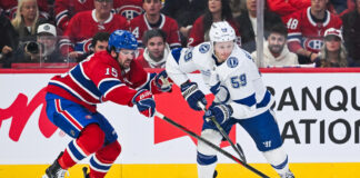 Newhook OT Winner Sends Habs to East Final, Joins Horton Montreal Canadiens center Alex Newhook defends the puck against Tampa Bay Lightning center Jake Guentzel during the 2026 Stanley Cup Playoffs First Round at Bell Centre