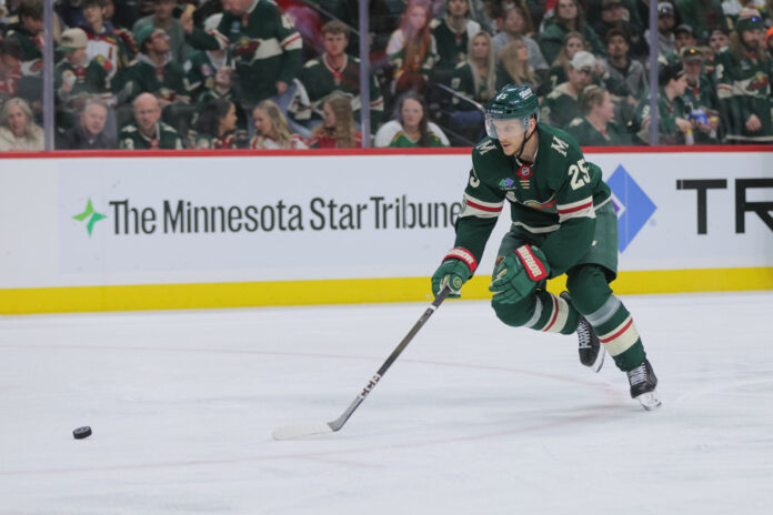 Jonas Brodin Minnesota Wild Stanley Cup Playoffs April 25 2026 Minnesota Wild defenseman Jonas Brodin looks at his stick during a Stanley Cup Playoffs first-round game against the Dallas Stars